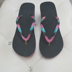Multicolored wedge flip flops size 9